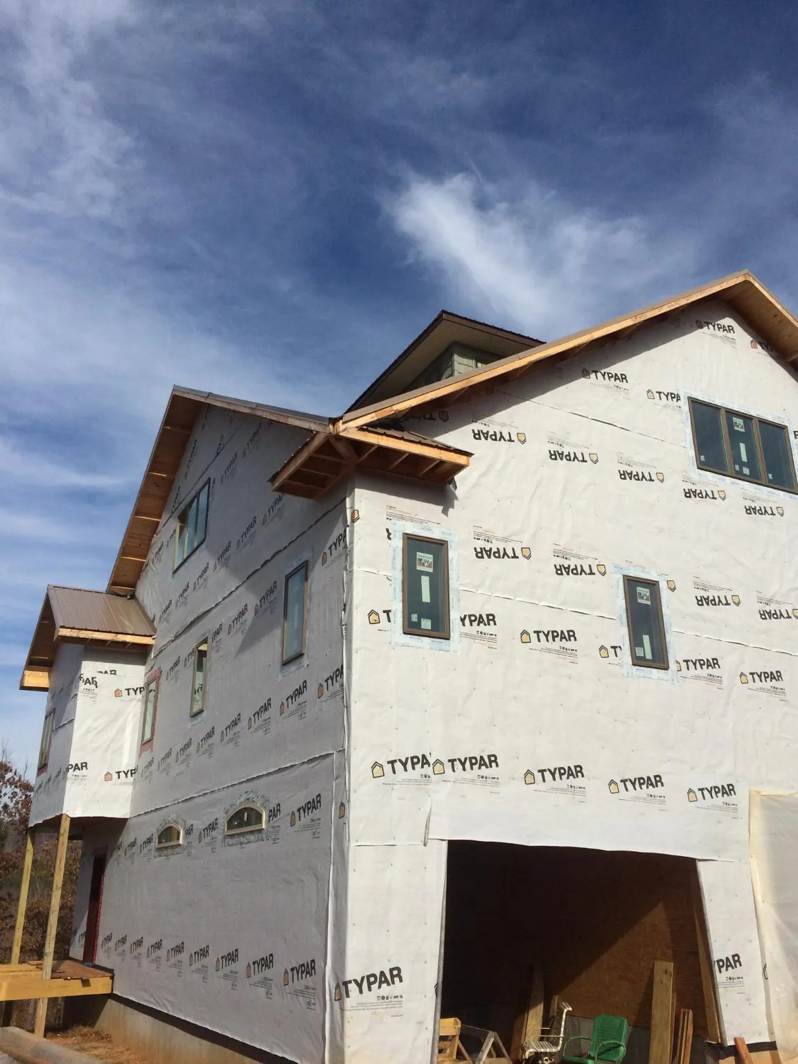Stick built house wrapped in Typar with new roof framing and dormers in Nunnelly